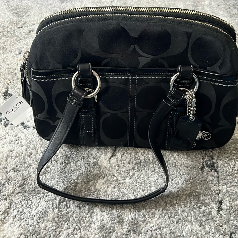 New black coach bag never been used